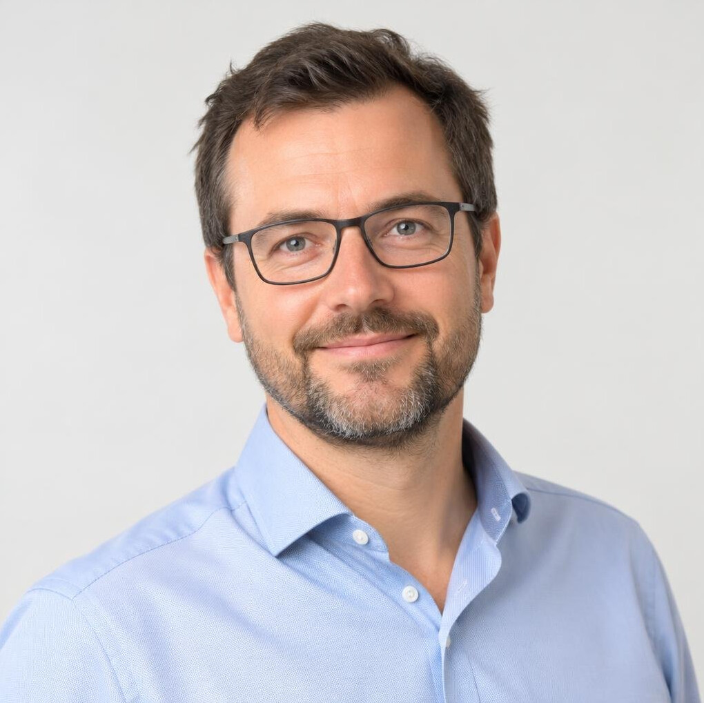 Portrait of a man trainer with a beard and glasses